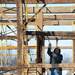 Construction worker Dan Haydon of DA Haig Construction, works to loosen a section of a historic barn as they carefully take it apart at Zingerman's Cornman Farms in Dexter on Monday, March 4, 2013. Melanie Maxwell I AnnArbor.com